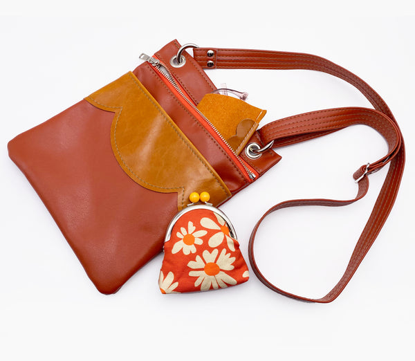 The Cloud Cross Body Travel Bag in Coral Tangerine