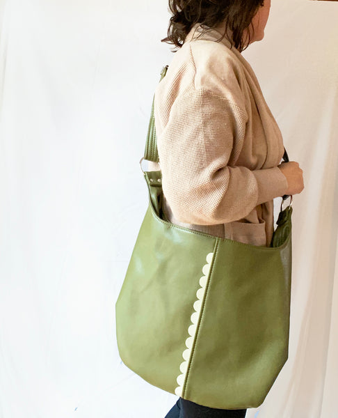 Person wearing a Twyla Cross Body Tote Bag.