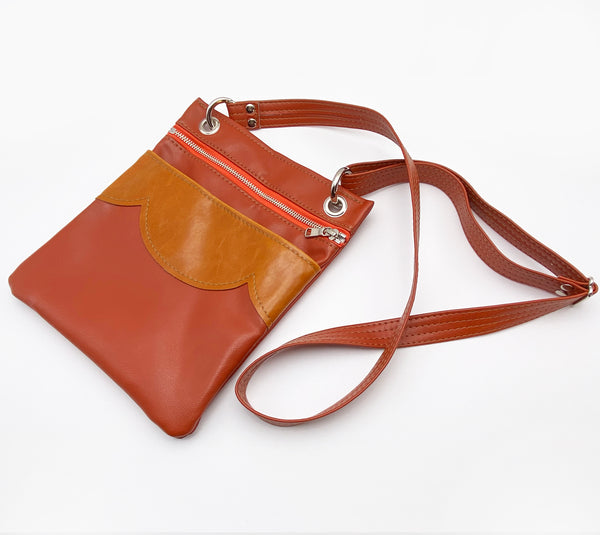 The Cloud Cross Body Travel Bag in Coral Tangerine